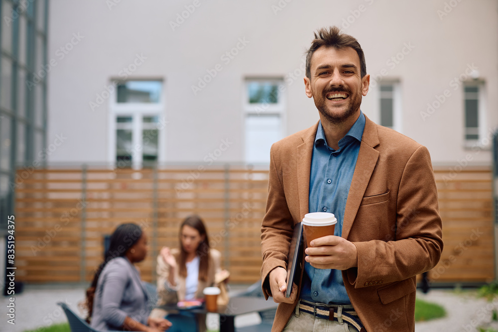 Happy entrepreneur enjoying on coffee break at work and looking at camera. Happy entrepreneur enjoying on coffee break at work and looking at camera.