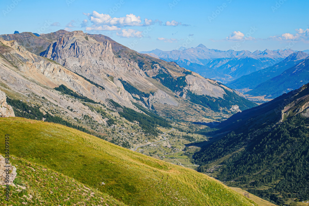 Valley of the Lautaret seen from the Col du Galibier, a mountain pass in the French Alps - This is the highest point of the Tour de France Valley of the Lautaret seen from the Col du Galibier, a mountain pass in the French Alps - This is the highest point of the Tour de France