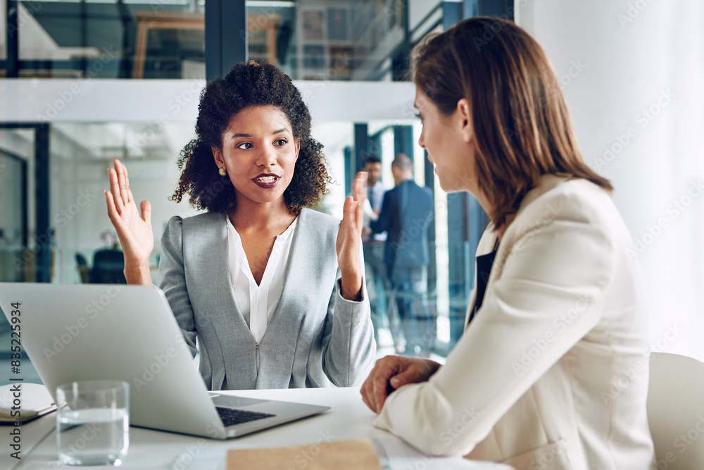© peopleimages.com - Laptop, talking and business women in office for discussion, meeting and consulting for online proposal. Corporate, financial advisor and people on computer for planning, website and feedback report