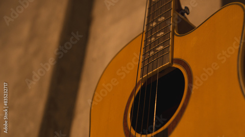 Close up of wooden classical acoustic guitar string, Concept of instrument and musical background with copy space, entertainment or musician vintage abstract banner.