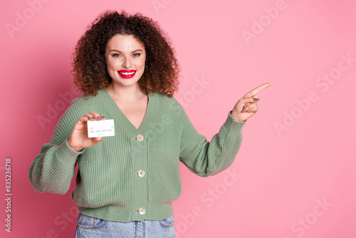 Photo of lovely adorable woman wear stylish khaki clothes promo empty space isolated on pink color background photo