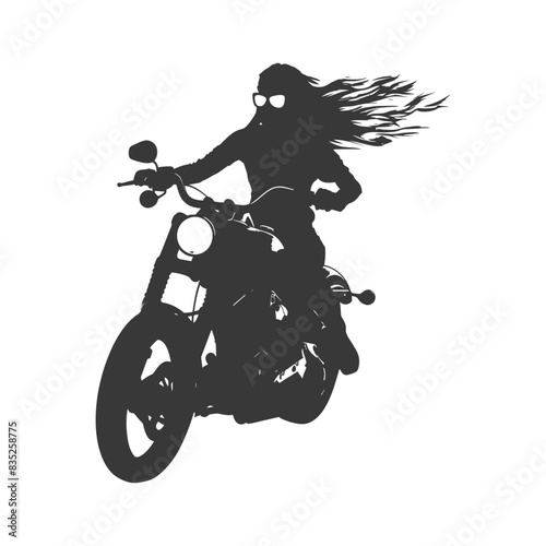 Silhouette: Long-haired biker with sunglasses rides a chopper.