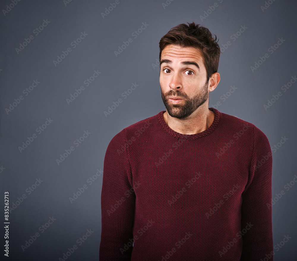 Studio, portrait and surprise of man, rumor and hearing of secret, confused and gossip of news in mockup. Black background, drama and listening of person, space and face of question for information