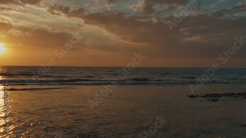 Twilight Glow: Sun Setting Over the Ocean