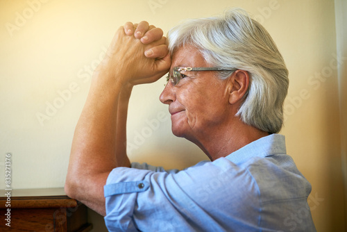 Tableau sur toile Thinking, praying or senior woman with hope in with memory, trauma or fear in living room alone