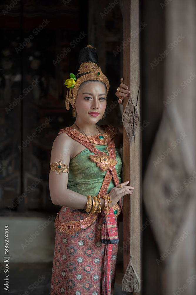 person in traditional costume. woman in traditional costume. Beautiful Asian woman wearing in Thai dress costume traditional according Thai culture and tradition sit and at ancient house Ayutthaya. person in traditional costume. woman in traditional costume. Beautiful Asian woman wearing in Thai dress costume traditional according Thai culture and tradition sit and at ancient house Ayutthaya.