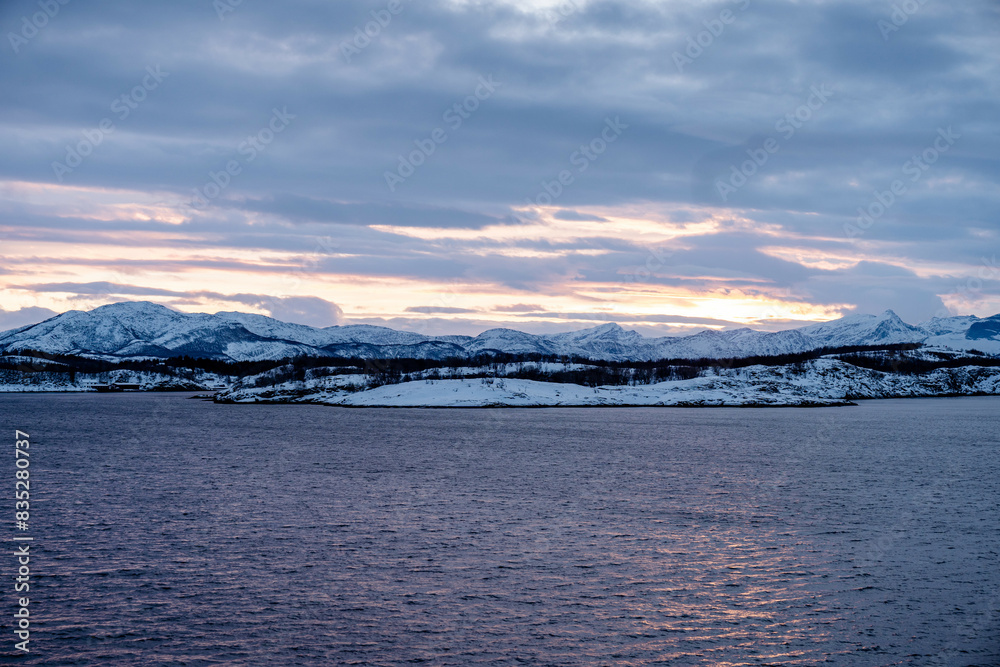 Fototapeta premium Winter in Norway at sea with mountainview