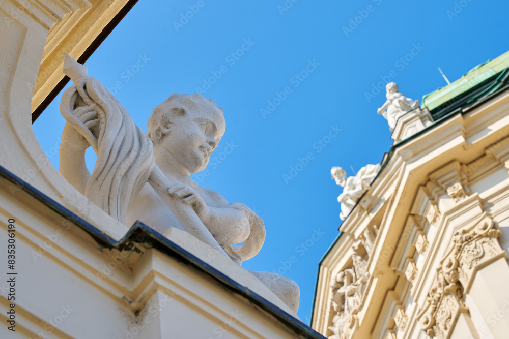 Obraz premium Vienna, Austria – September 26, 2023. Belvedere Palace Statue Close Up Vienna Austria. A Belvedere Palace statue close up outdoors. A UNESCO World Heritage Site. 