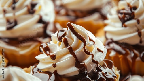 Close-up of delicious desserts featuring whipped cream and chocolate drizzle, highlighting the variety and richness of sweet treats. Perfect for food and culinary photography photo