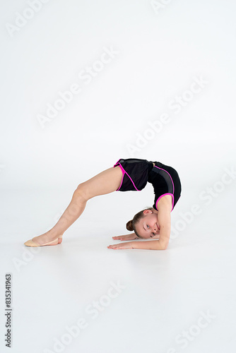 young girl doing gymnastics exercises