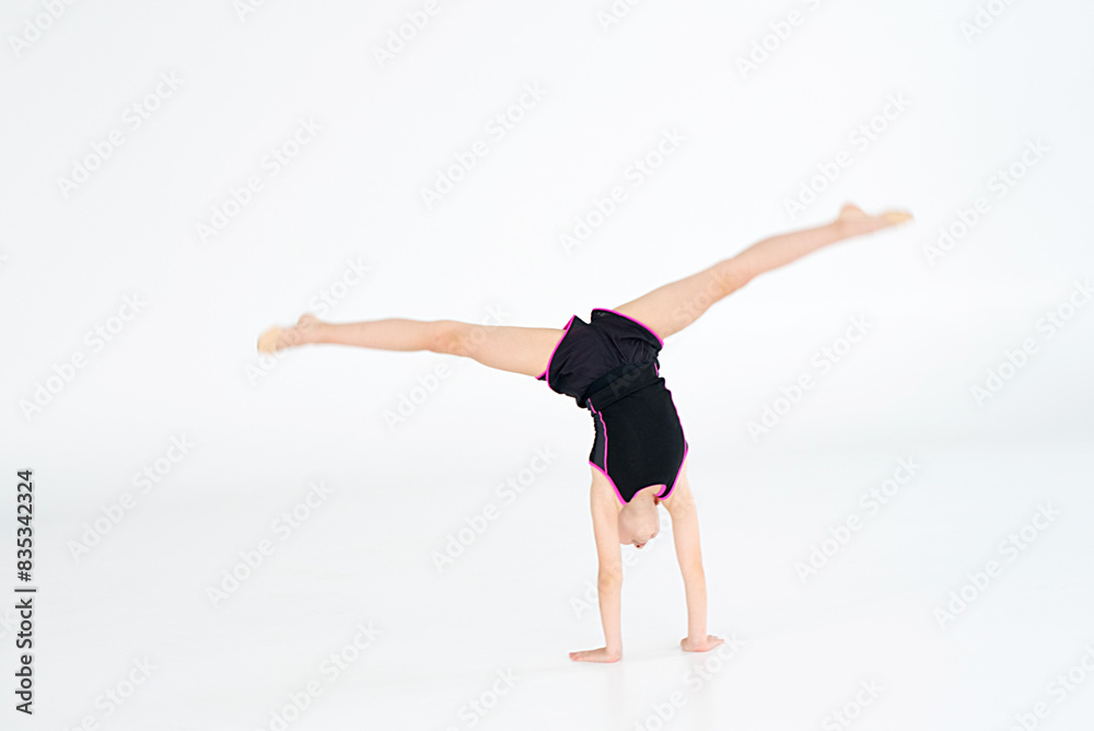 Young girl doing gymnastics Young girl doing gymnastics