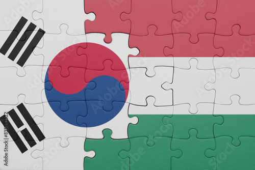 puzzle with the colourful national flag of hungary and flag of south korea.