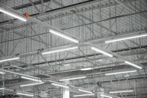 Obraz na płótnie Empty factory interior or storehouse. Warehouse roof with lighting equipment w salonie