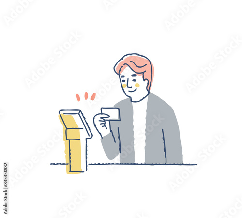 セルフオーダーシステムでカード決済する男性