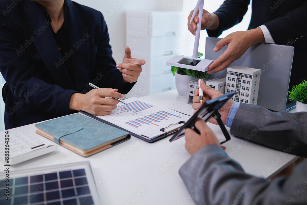custom made wallpaper toronto digitalarchitects and investors discuss real estate projects using clean energy or solar cells within residential construction projects. Concept using clean energy in large residential construction projects.
