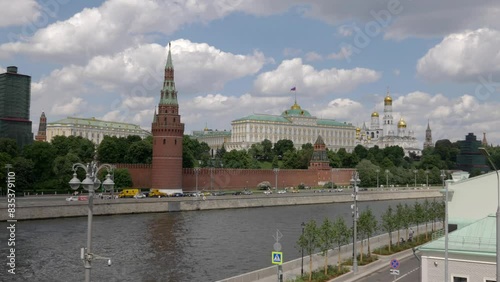 View of the Moscow Kremlin from the Moscow river. Red brick towers and Bell Tower Of Ivan The Great.