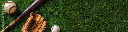 baseball bat, glove, and ball arranged in a diagonal line on green grass, with ample space for text or advertisements