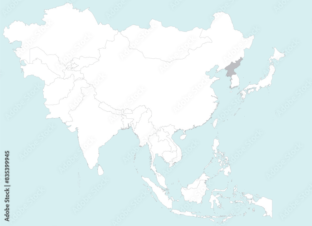 Obraz premium Highlighted grey map of NORTH KOREA inside white detailed blank political map of Asia on blue background, without the Middle East and Russia