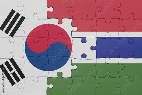 puzzle with the colourful national flag of gambia and flag of south korea.