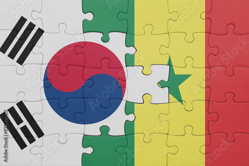 puzzle with the colourful national flag of senegal and flag of south korea.