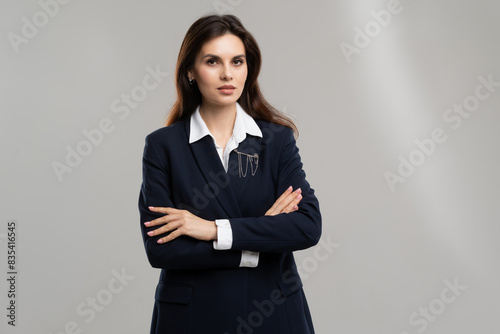Confident businesswoman in formal attire striking a pose