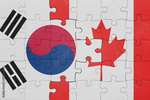 puzzle with the colourful national flag of canada and flag of south korea.