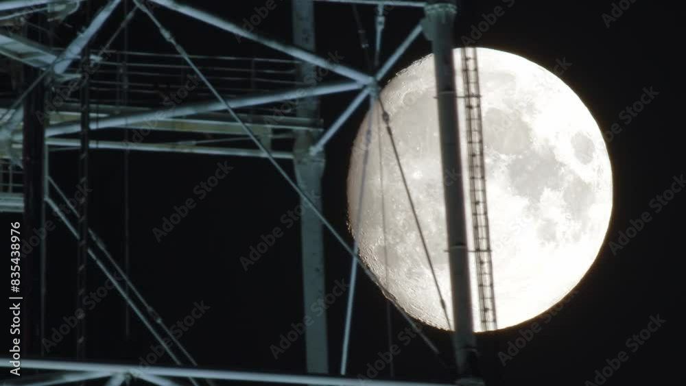 A majestic view of the full moon, perfectly framed by the geometric ...