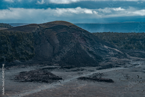 Kīlauea Iki is a pit crater that is next to the main summit caldera of Kīlauea on the island of Hawaiʻi in the Hawaiian Islands.   Pu'u Pua'i cinder cone .  Hawaii Volcanoes National Park, Kilauea  photo