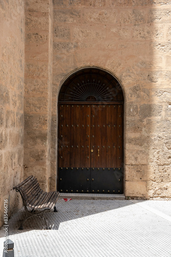 Antique Wooden Door on a Stone Building Facade