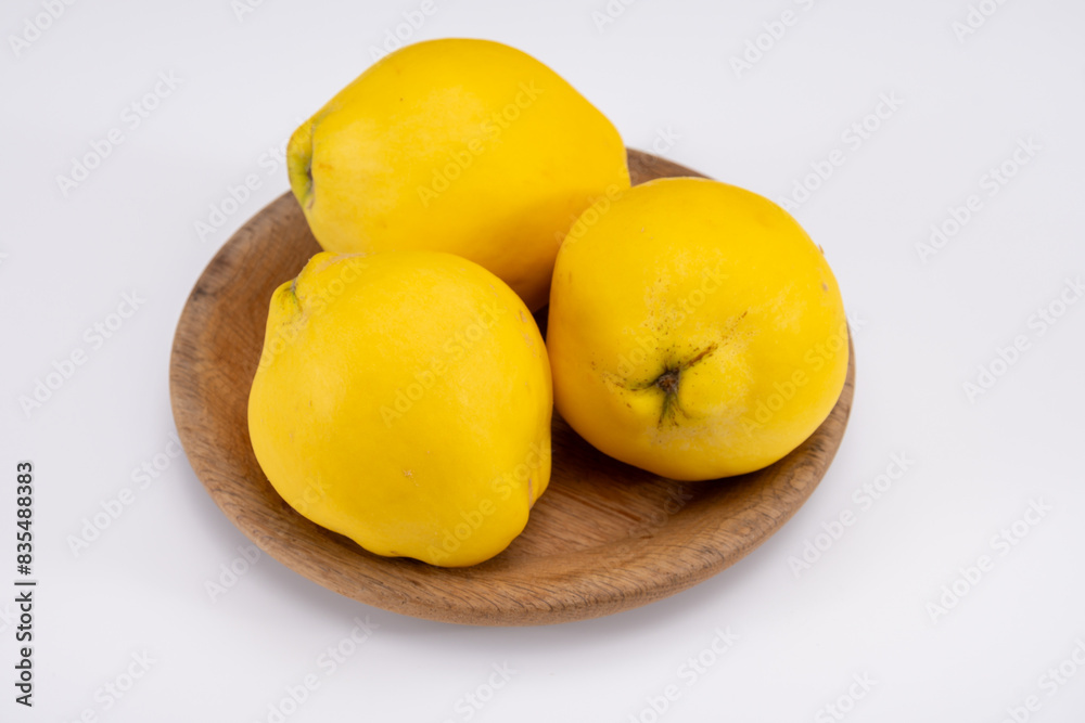 Group of ripe yellow quince apples close up Group of ripe yellow quince apples close up