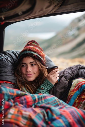 A woman sits in the rear seat of a car  looking straight ahead