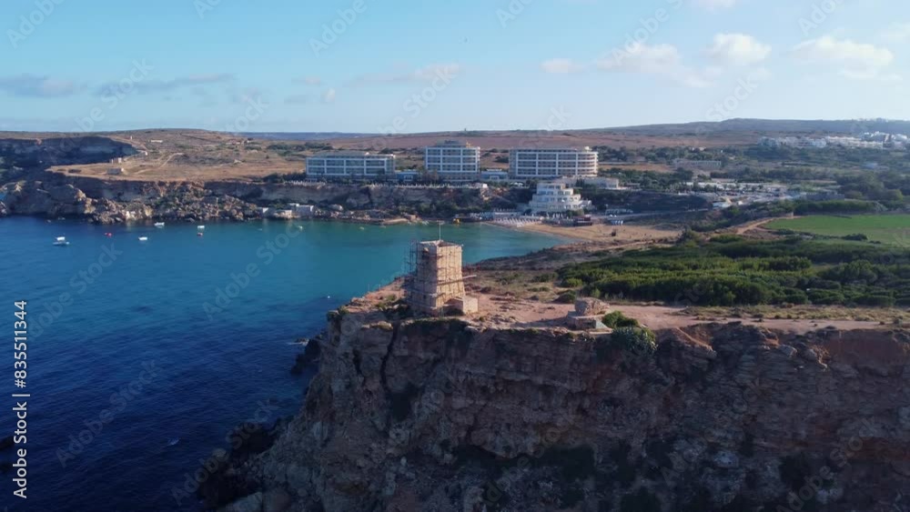 Malta Ghajn Tuffieha bay, World war 2 pillbox, watchtower and abandoned building. Revealing golden sand beach. High quality 4k footage Malta Ghajn Tuffieha bay, World war 2 pillbox, watchtower and abandoned building. Revealing golden sand beach. High quality 4k footage