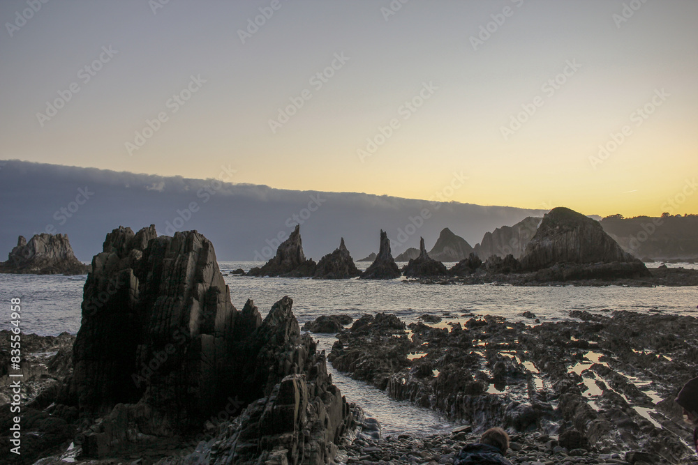 Fototapeta premium dawn lights near Cudillero, Spain, in Gueirua beach