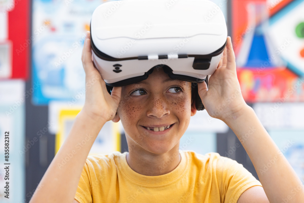 Biracial boy explores virtual reality in a classroom at school Biracial boy explores virtual reality in a classroom at school