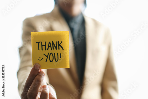 Selective Focus Of Businessman Holding Thank You Written On Sticky Note.