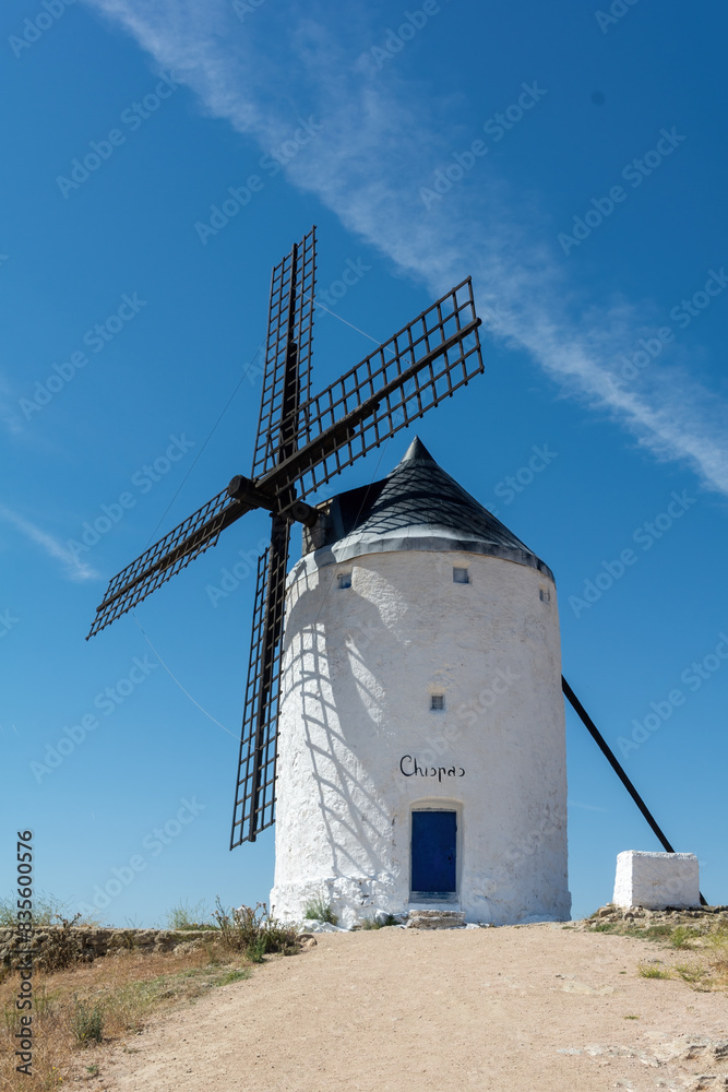 Nice view of an old windmill on a hill in Consuegra, Toledo, Castilla la Mancha, Spain Nice view of an old windmill on a hill in Consuegra, Toledo, Castilla la Mancha, Spain