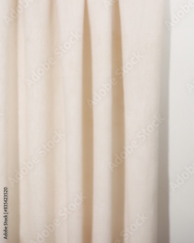 Cream background with curtain texture and bright lighting, eye level