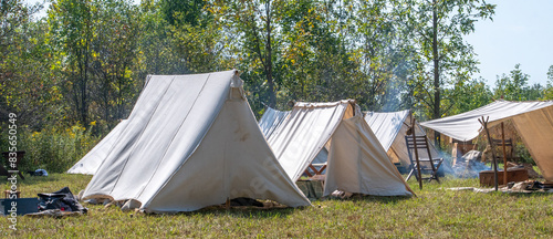 Camp site with tents and camp fires at a civil war reenactment 