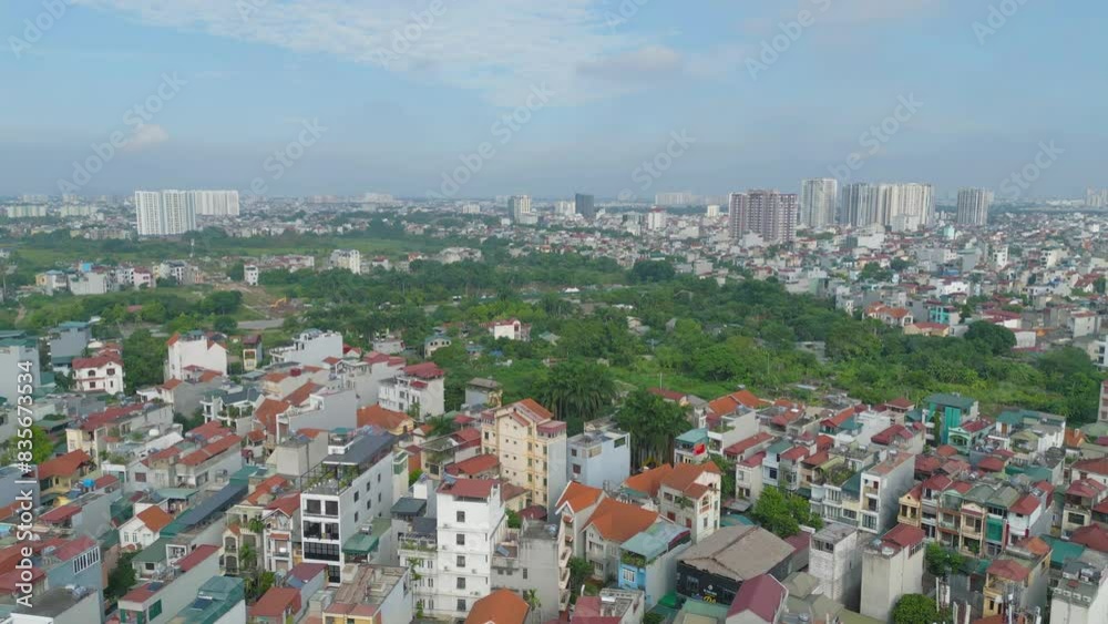 Aerial view of residential neighborhood roofs. Urban housing development from above. Top view. Real estate in Hanoi City, Vietnam. Property real estate. Aerial view of residential neighborhood roofs. Urban housing development from above. Top view. Real estate in Hanoi City, Vietnam. Property real estate.