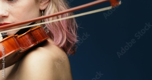 Red lips focus, music flows, backdrop blue