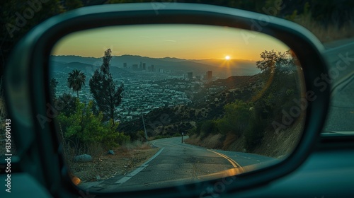 Urban Reflections: Los Angeles in a Car Mirror.  a unique perspective of Los Angeles seen through a car's side mirror, emphasizing a blend of urban exploration and nostalgic travel themes.  photo