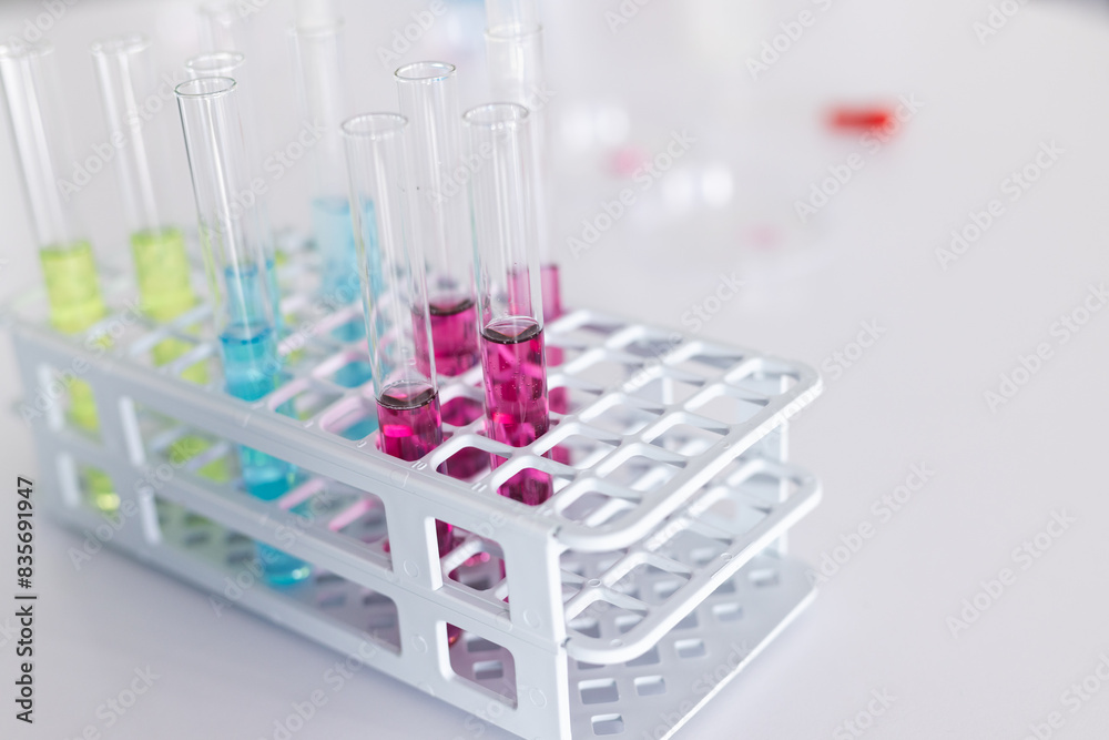 © Wavebreak Media - Test tubes filled with colorful liquids in a lab rack, with copy space © Wavebreak Media - Test tubes filled with colorful liquids in a lab rack, with copy space