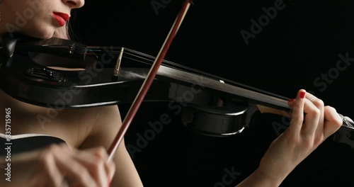 Blonde violinist, fuchsia hair, plays black violin