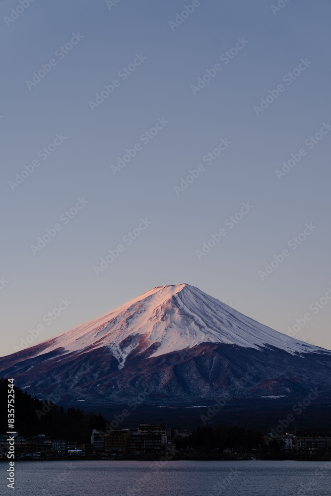 Majestic view of Mount Fuji with a serene lake in foreground Majestic view of Mount Fuji with a serene lake in foreground