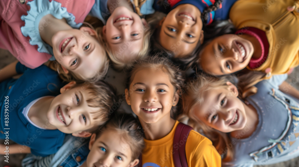 Portrait of smiling school kids standing in circle at school yard with look in camera Portrait of smiling school kids standing in circle at school yard with look in camera