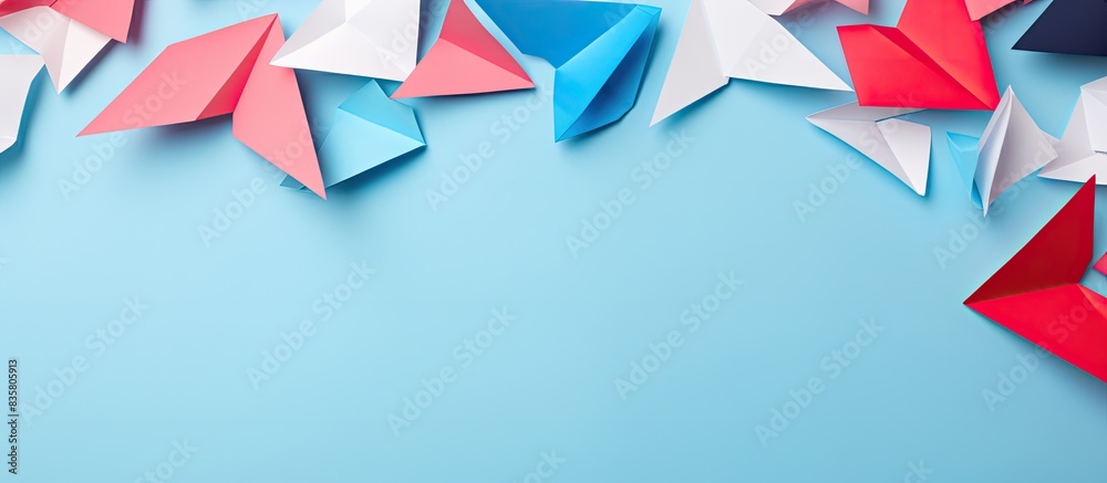 Origami art featuring numerous paper planes set against a white backdrop, allowing for copy space image. Origami art featuring numerous paper planes set against a white backdrop, allowing for copy space image.