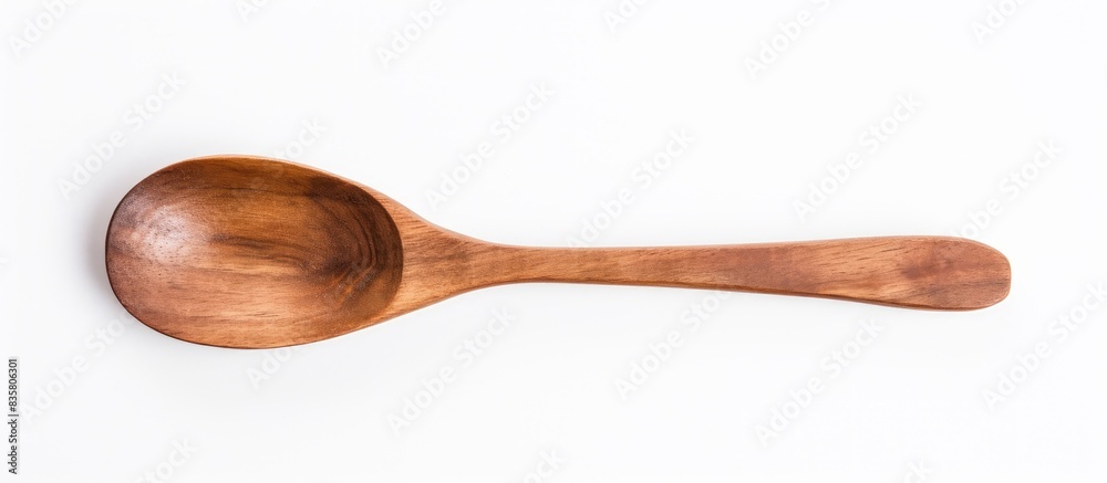 Top view of a blank wooden spoon on a white background with copy space image. Top view of a blank wooden spoon on a white background with copy space image.