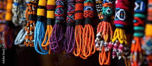 Mexican handicrafts featuring intricate chaquira beadwork in various colors, perfect for a copy space image.