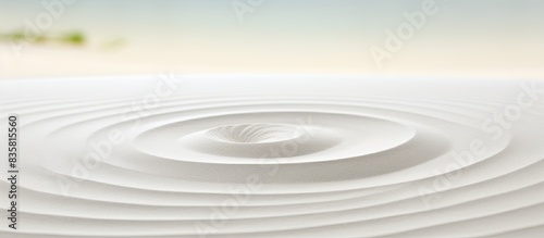 Zen Japanese garden background with a circular sand pattern for a horizontally oriented banner with copy space image.