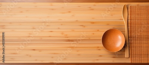 View of a woven luncheon mat on a white background with copy space image at an angle.